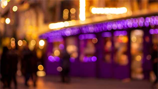 A purple shop in a warm street scene from Shop Stories